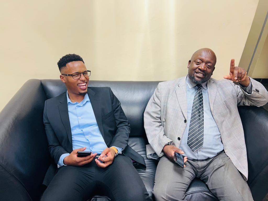Wearing glasses Nketoana municipality's CFO Jabulane Makubu, wearing a tie MM Mokete Nhlapho.