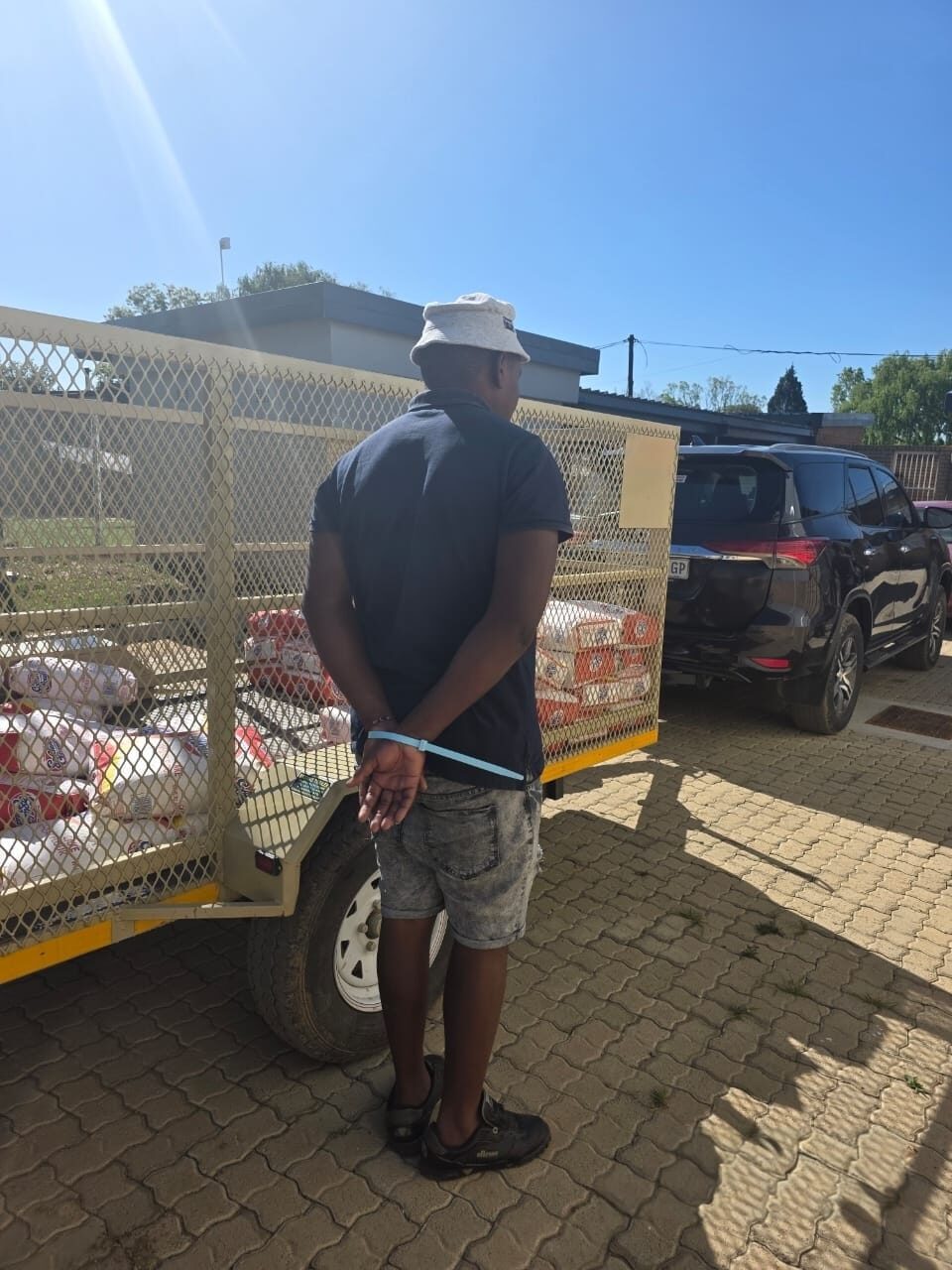 Community member caught red-handed after looting overturned truck on N3