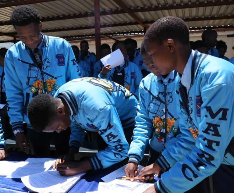 Mohato Secondary school matric class of 2025 signing their pledge.