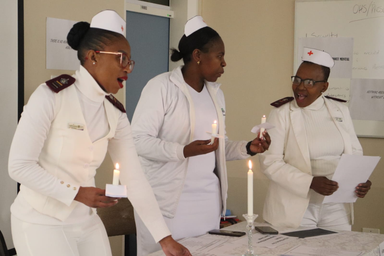 Elizabeth Ross nurses lit candles on World nurses day as they said the nurses pledge.
