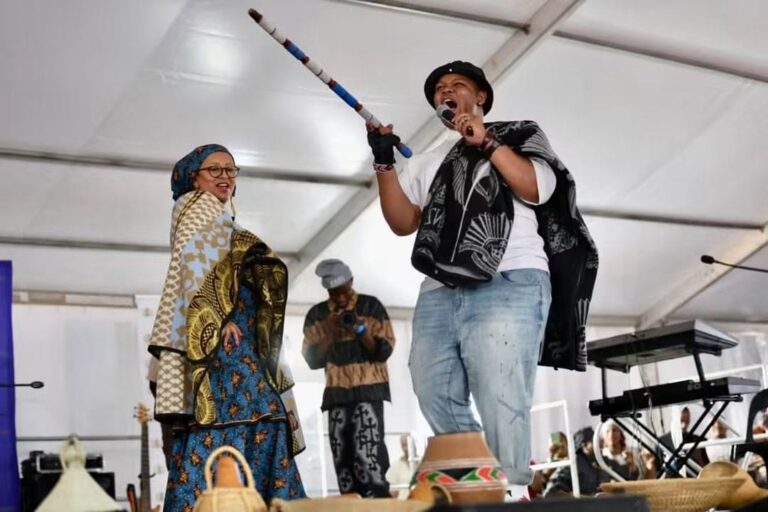 Free State Premier MaQueen Letsoha Mathae joining Sotho hip pop Relebohile Monaphathi known as Sannere, on the stage during celebration of Heriday Day in Phuthaditjhaba.